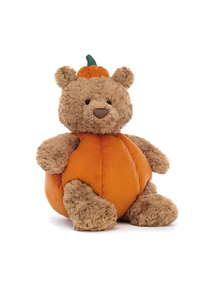 Bear plush in a pumpkin costume