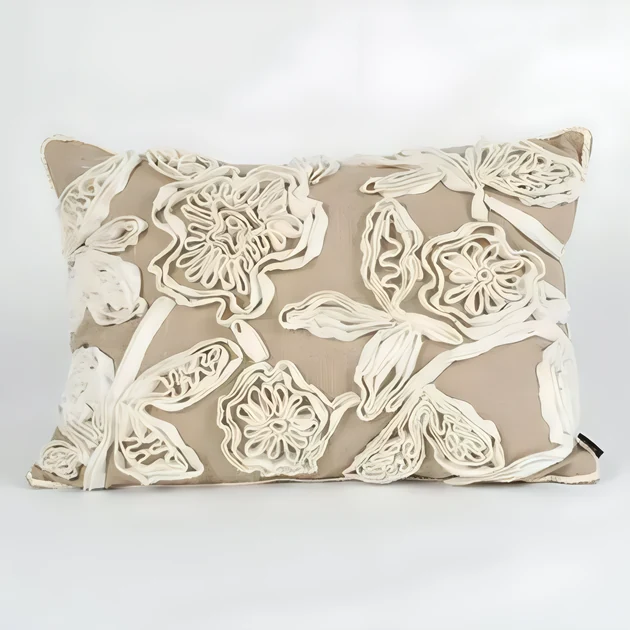 Cushion with raised floral appliqué