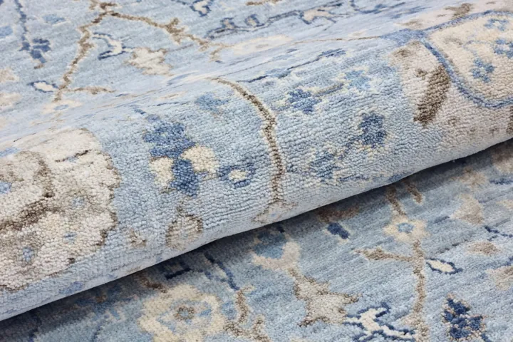 Folded pale blue rug