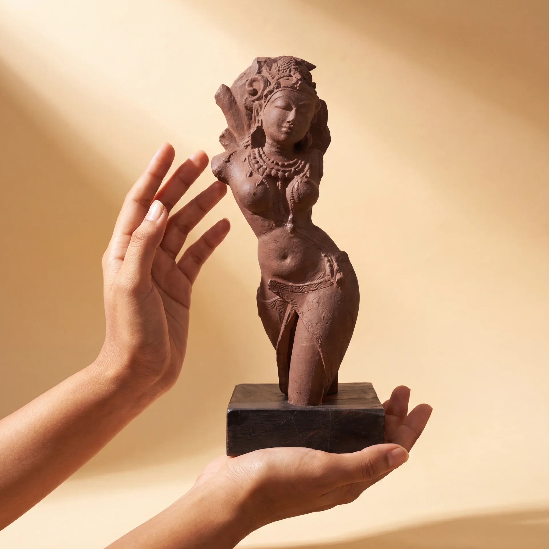 A Salabhanjika sculpture held in two hands